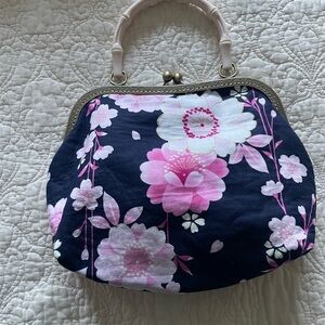 Chic White Clutch with Pink Lining and Patterned Interior